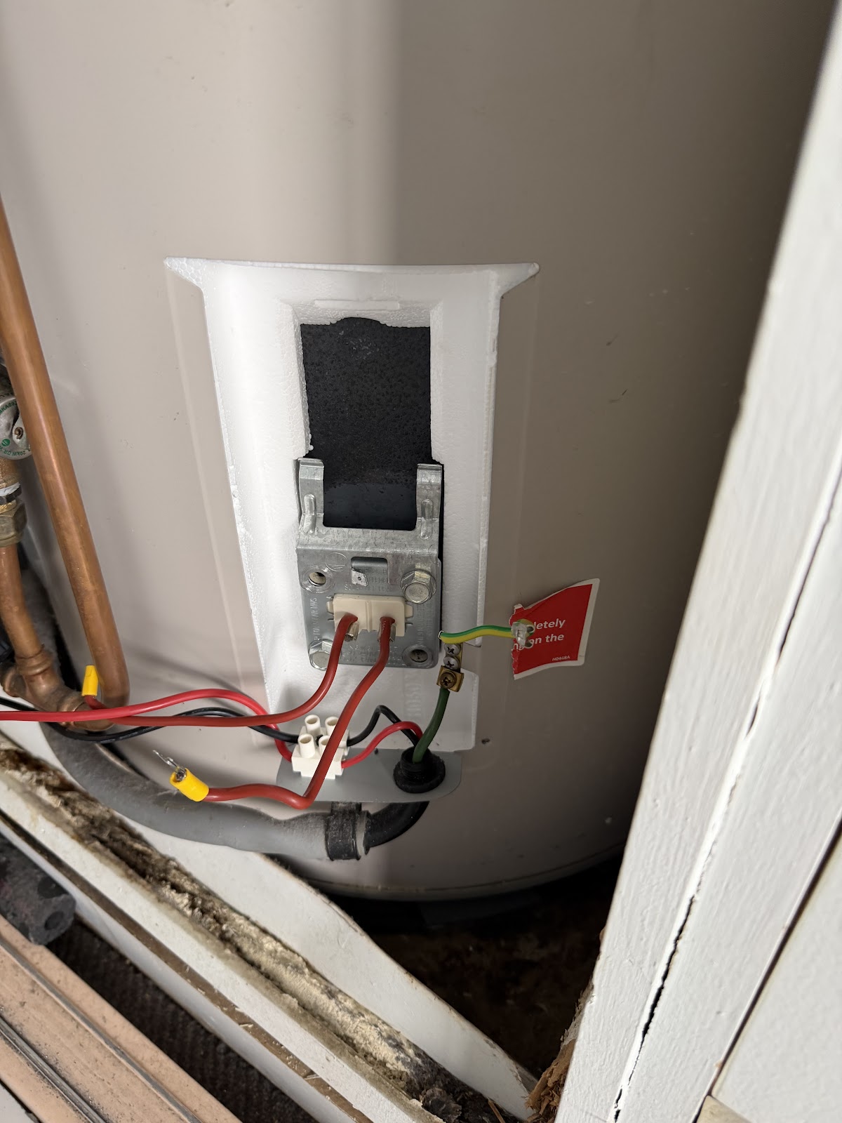 An electric hot water system opened up for repair